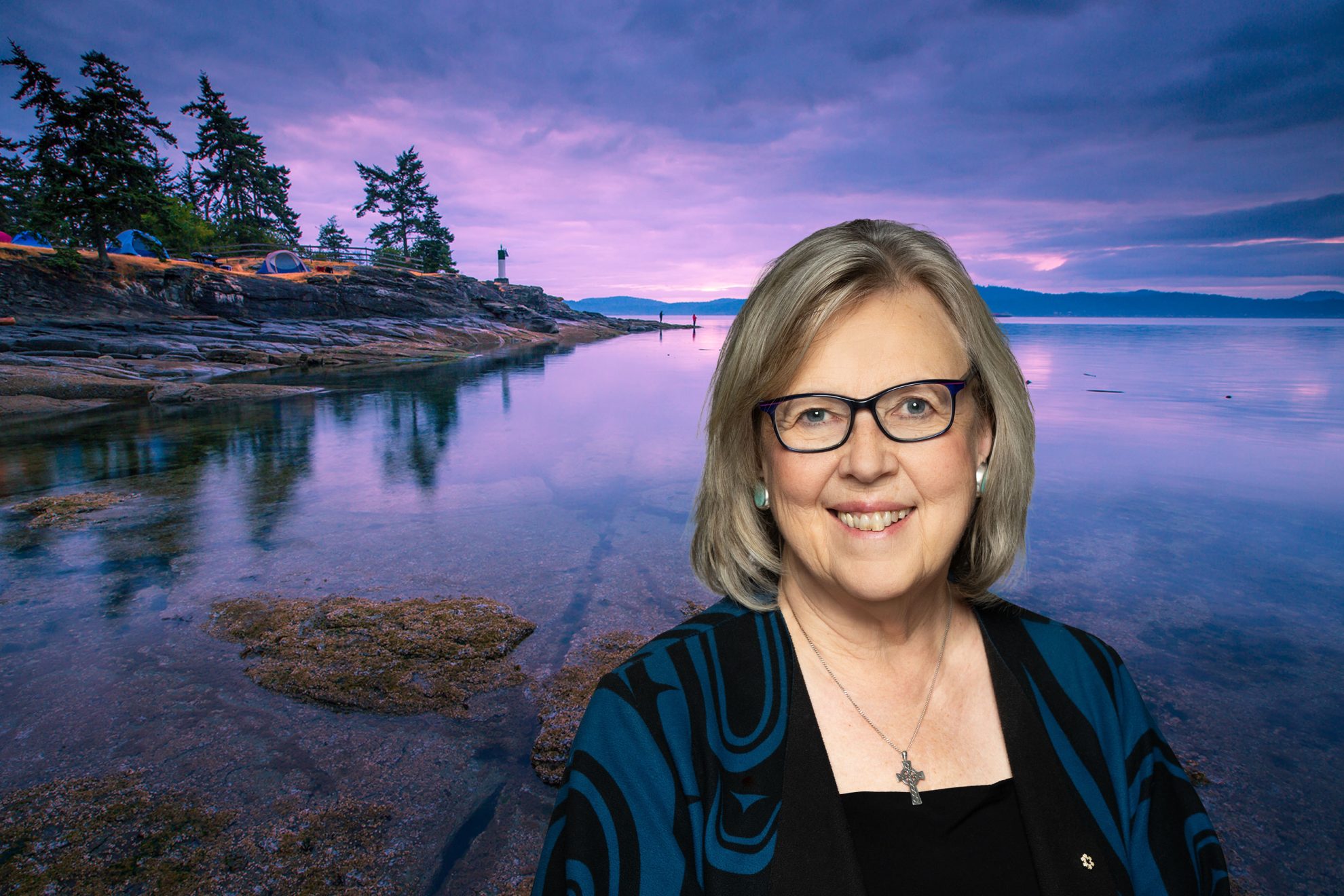 Photo of Elizabeth may with a Saanich-Gulf Islands scene in the background.